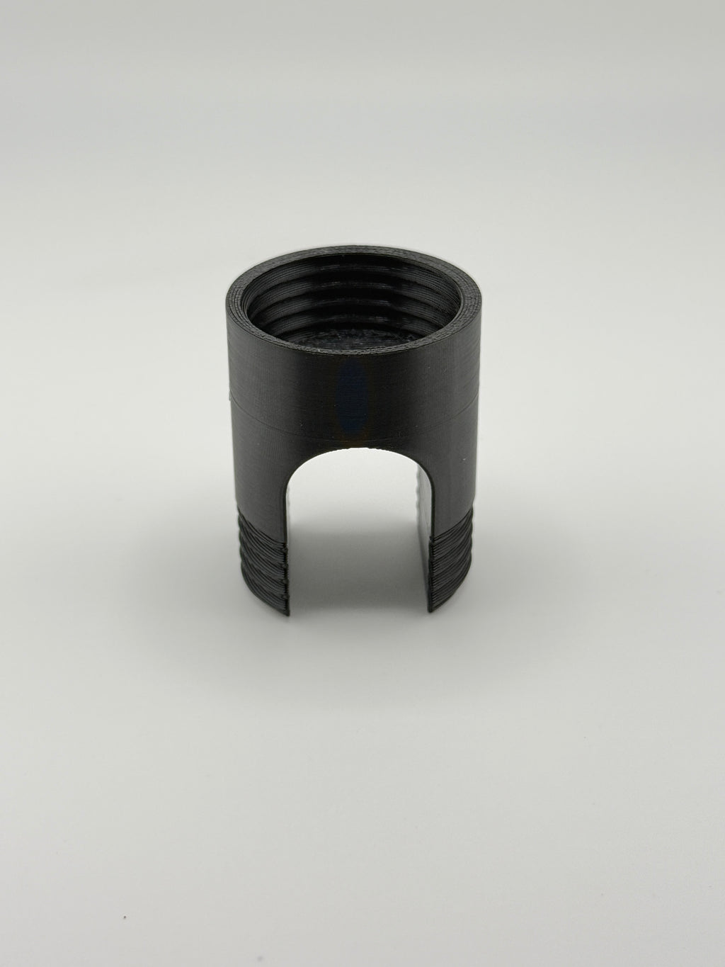 TrackMount main body showing the threaded tracker compartment and lateral cane opening