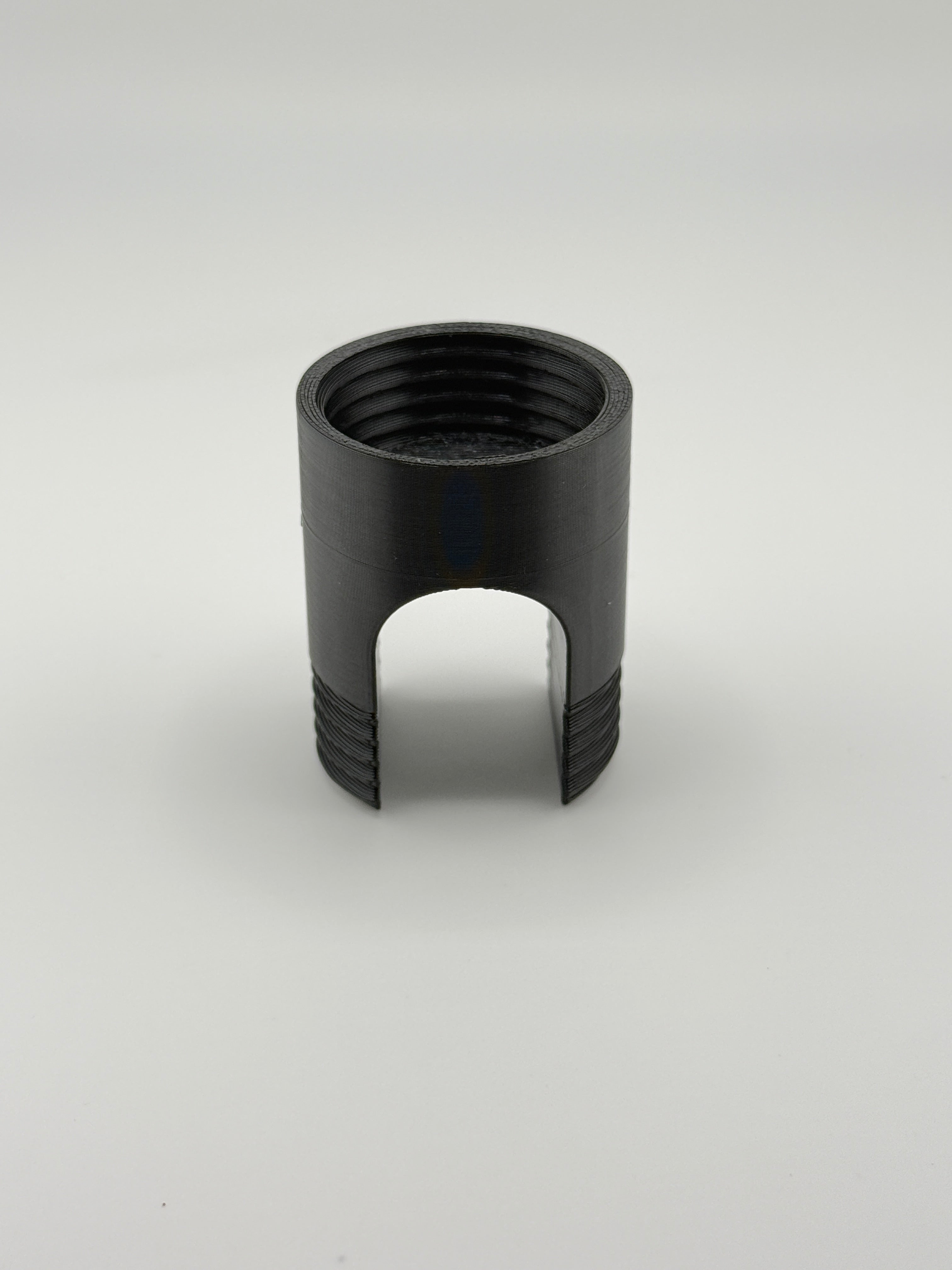 TrackMount main body showing the threaded tracker compartment and lateral cane opening