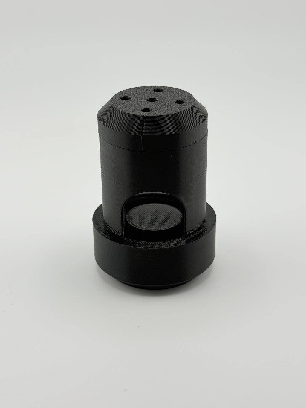 Assembled black TrackMount cane tracker holder with perforated cap on top