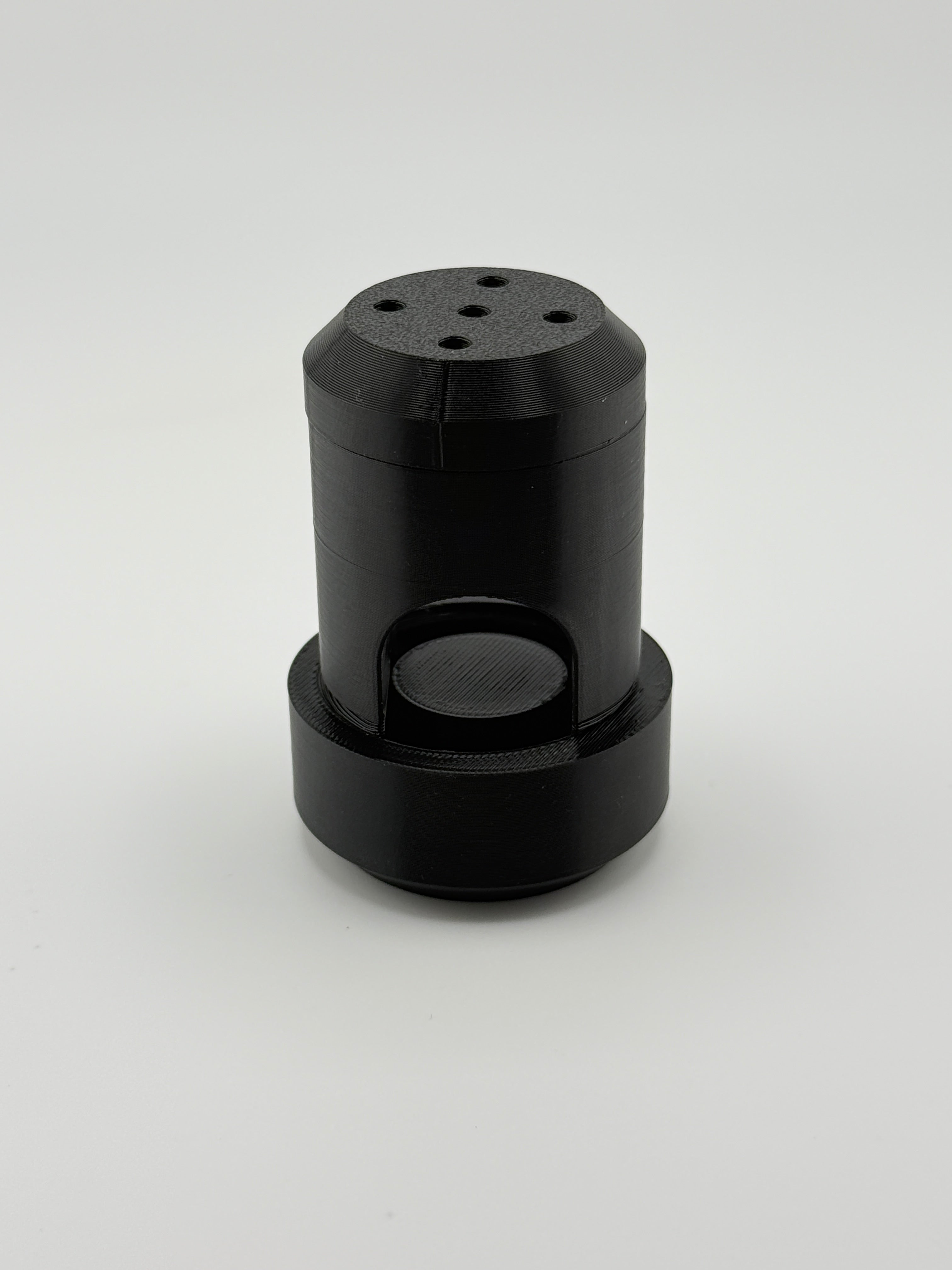 Assembled black TrackMount cane tracker holder with perforated cap on top