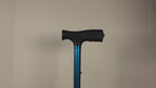 Video of TrackMount being installed on a blue walking cane. Once installed, the user shakes the cane to show the TrackMount is secured tightly to the cane.