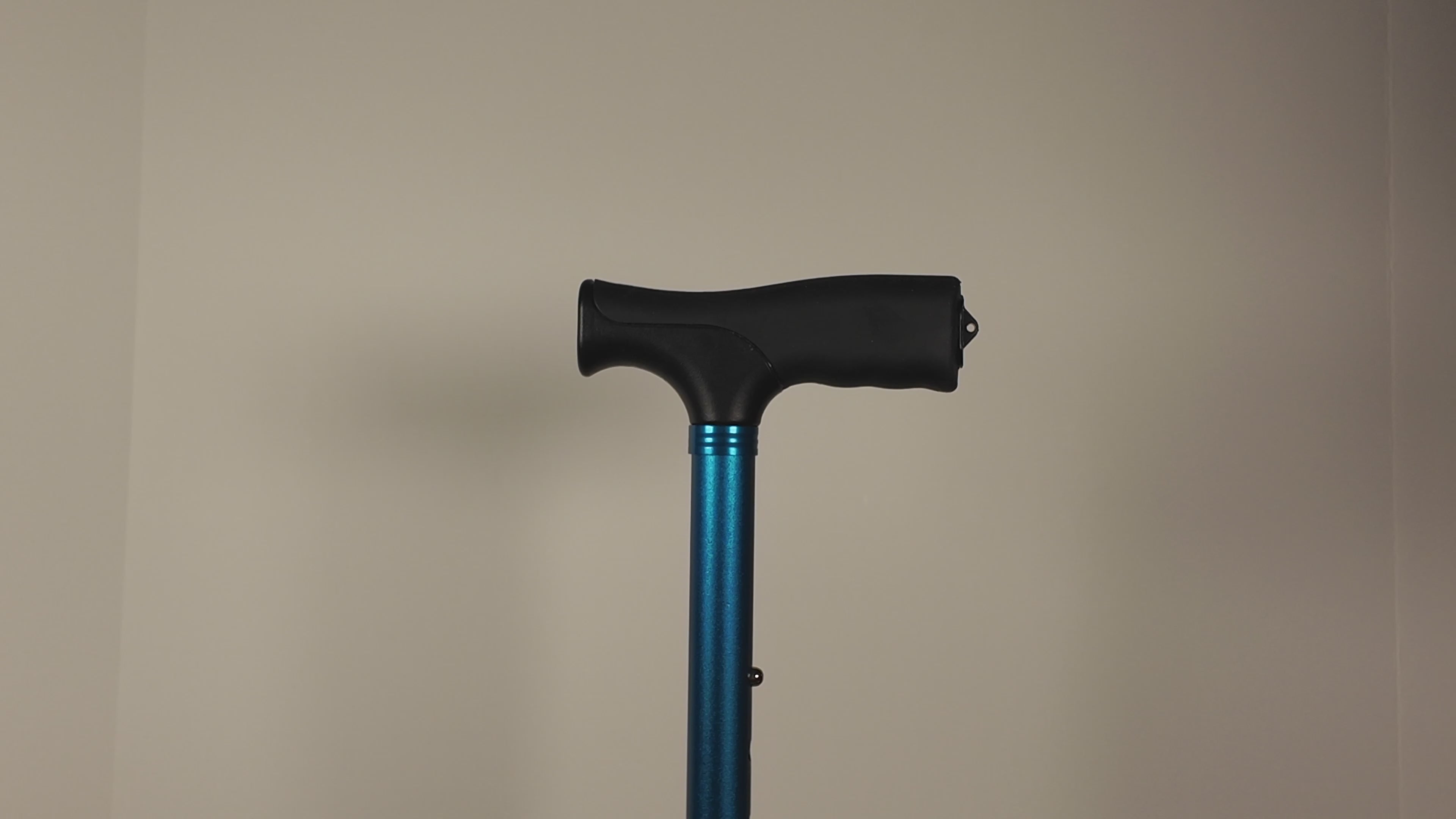 Video of TrackMount being installed on a blue walking cane. Once installed, the user shakes the cane to show the TrackMount is secured tightly to the cane.