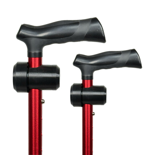 Two black TrackMount tracker holders mounted on red aluminum walking canes, shown against a white background