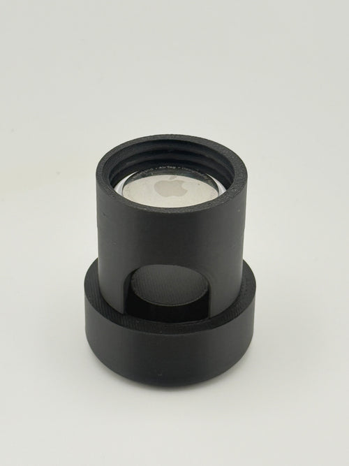 TrackMount body standing upright with an Apple AirTag resting inside the open tracker compartment