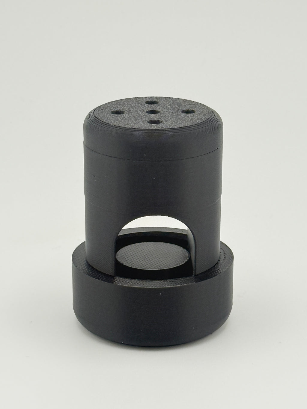 Fully assembled black TrackMount with the perforated cap on top and the U-shaped slot that fits over a cane