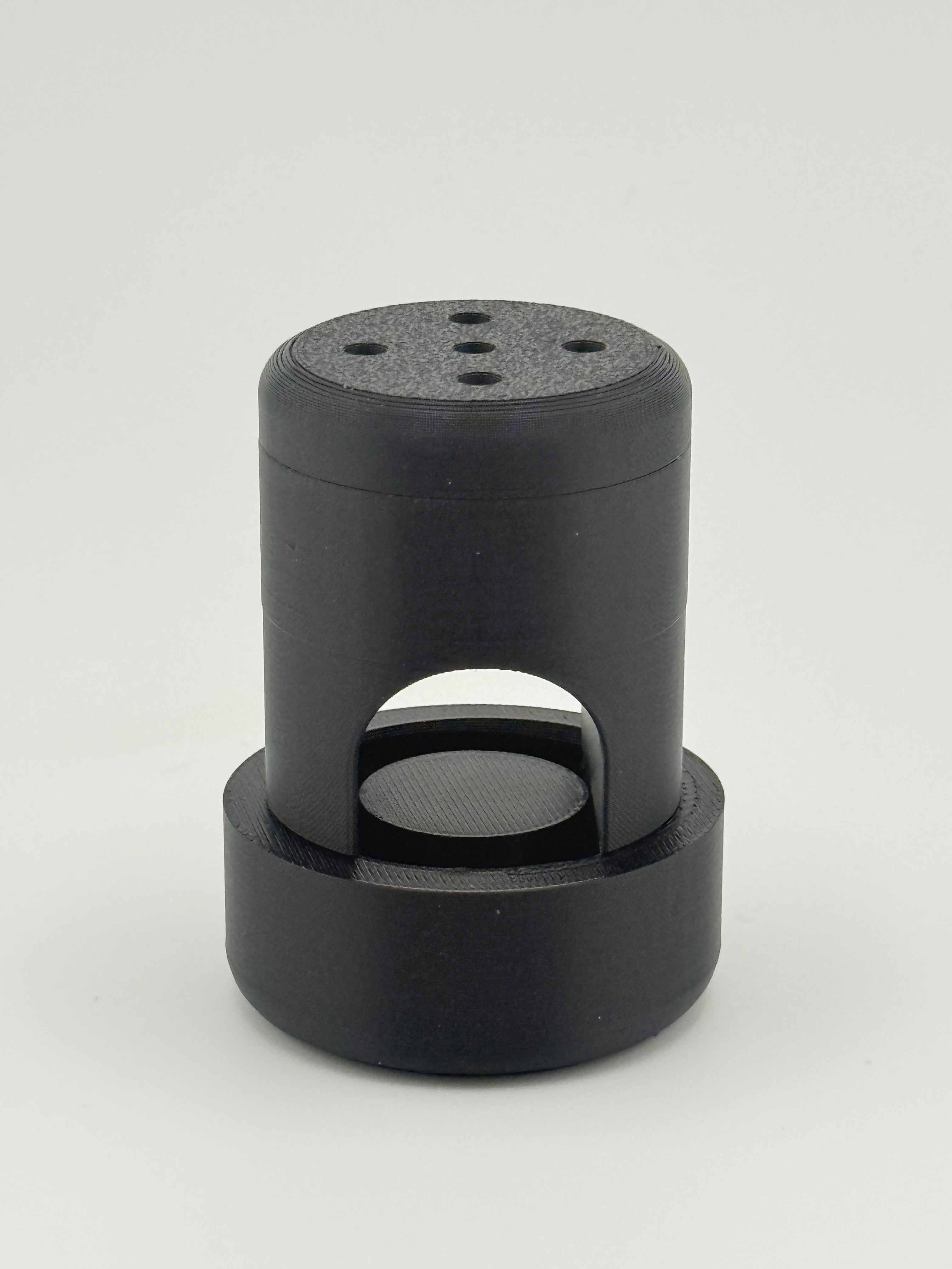 Fully assembled black TrackMount with the perforated cap on top and the U-shaped slot that fits over a cane
