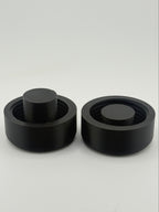 Two black TrackMount clamping caps: one for standard canes and one for thinner white canes