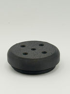Black perforated TrackMount tracker cap with five holes that let the tracker chime sound through