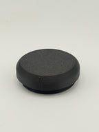 Black solid TrackMount tracker cap with a smooth sealed top for extra protection from moisture and debris