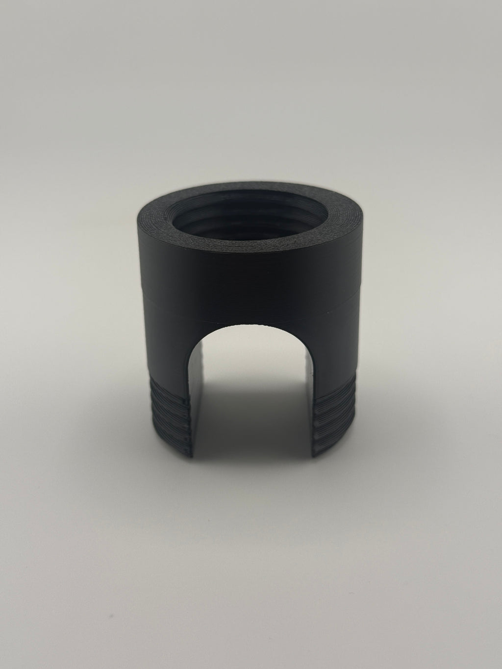 TrackMount XL main body, the threaded black holder that clamps onto the cane shaft