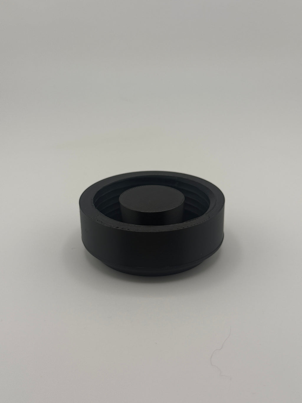 TrackMount XL main cap with internal threads and center post, shown from above