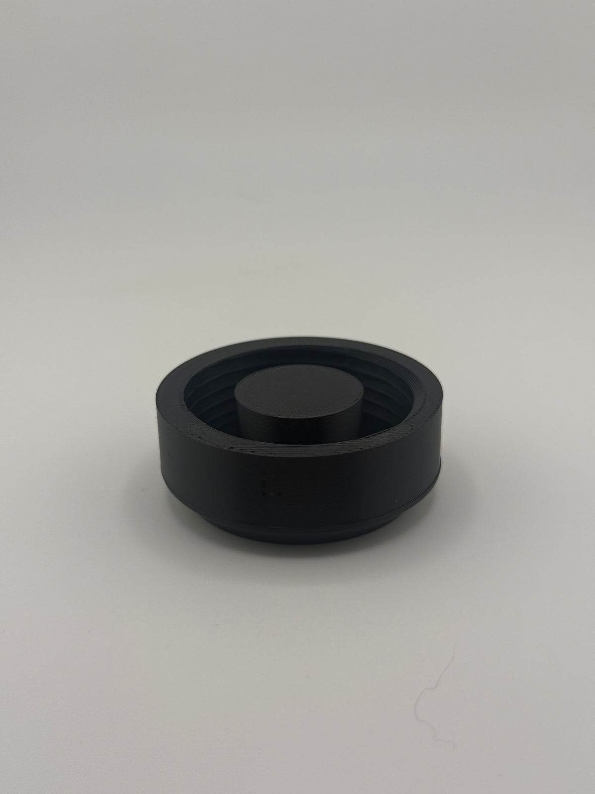 TrackMount XL main cap with internal threads and center post, shown from above