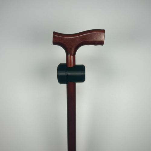 TrackMount XL black tracker holder mounted below the handle on a wooden walking cane